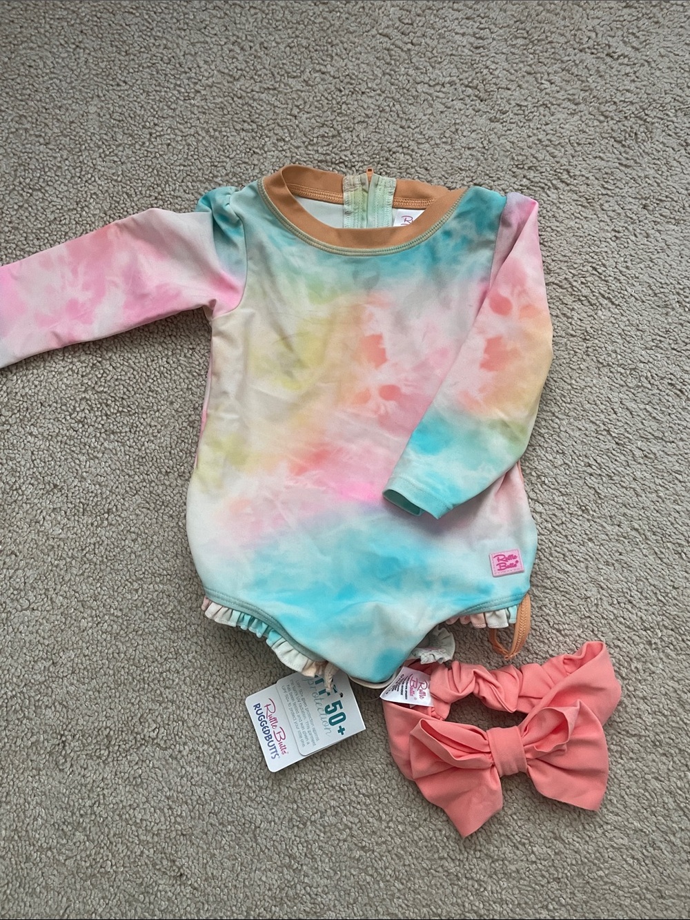 Ruffle Butts Pastel Tie-Dye Long Sleeve One-Piece with Coral Bow
